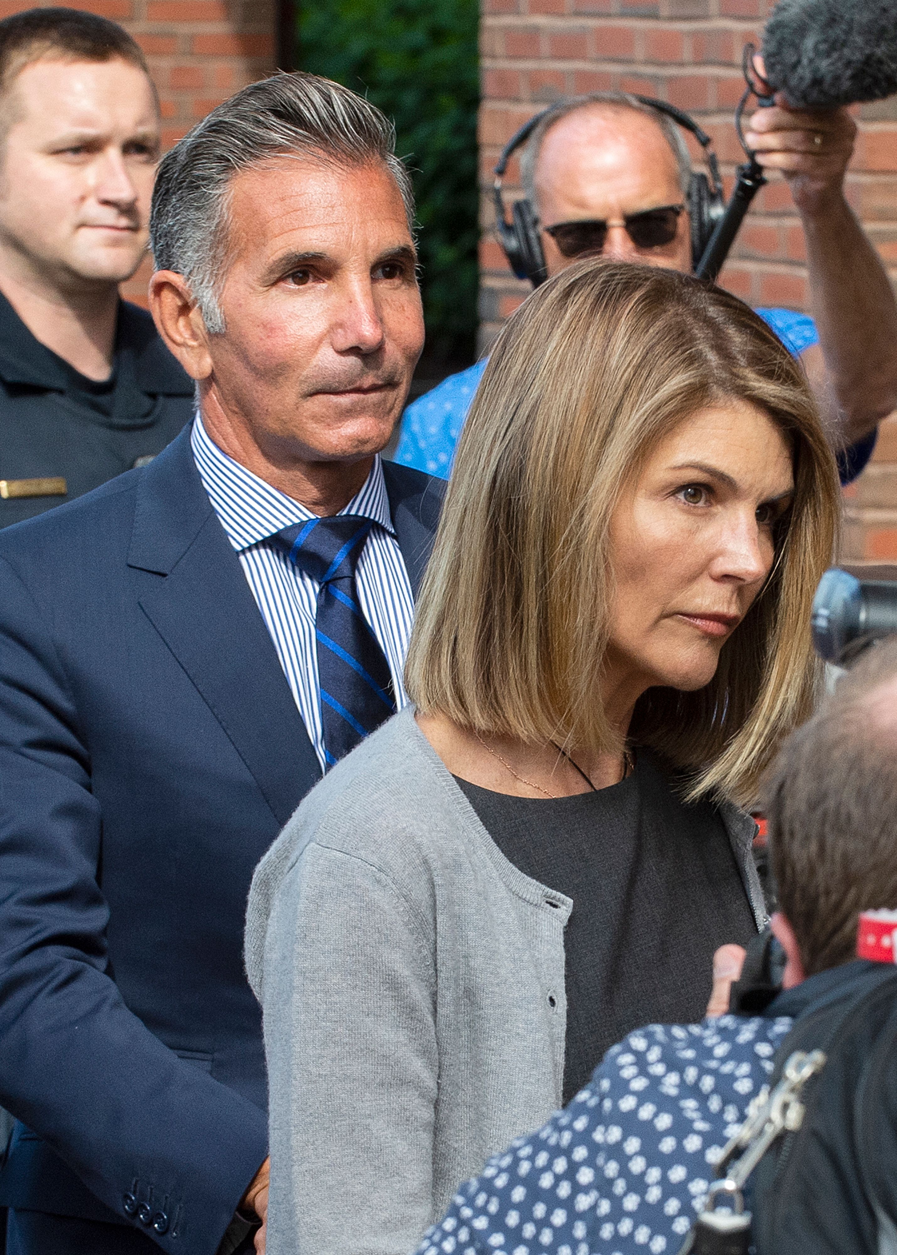 Lori Loughlin and her husband Mossimo Giannulli, right, leave the John Joseph Moakley United States Courthouse in Boston on August 27, 2019. | Source: Getty Images