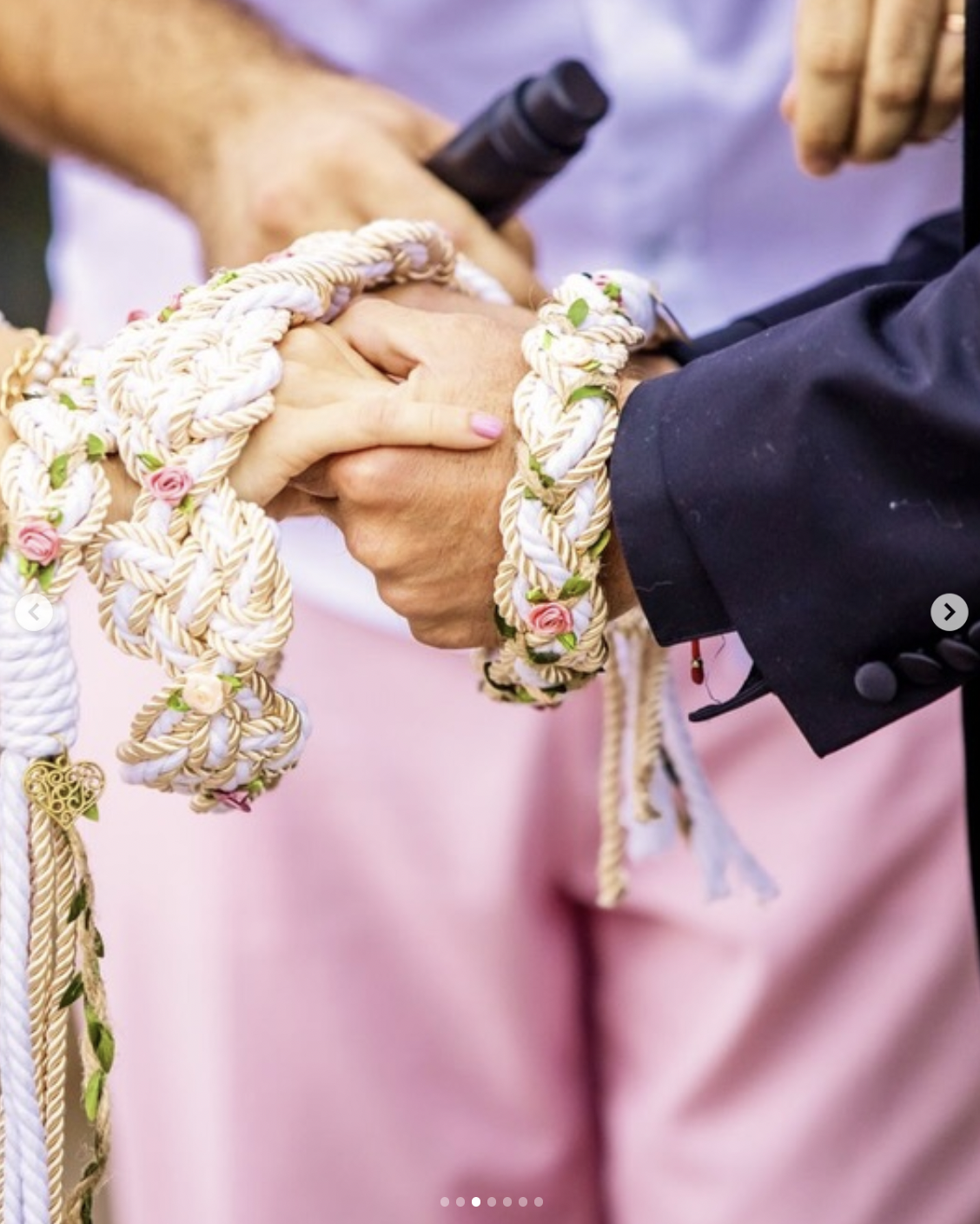 The hands of AnnaLynne McCord and Danny Cipriani joined together by a decorative rope in a handfasting ceremony during their wedding day on August 22, 2026 | Source: instagram/people