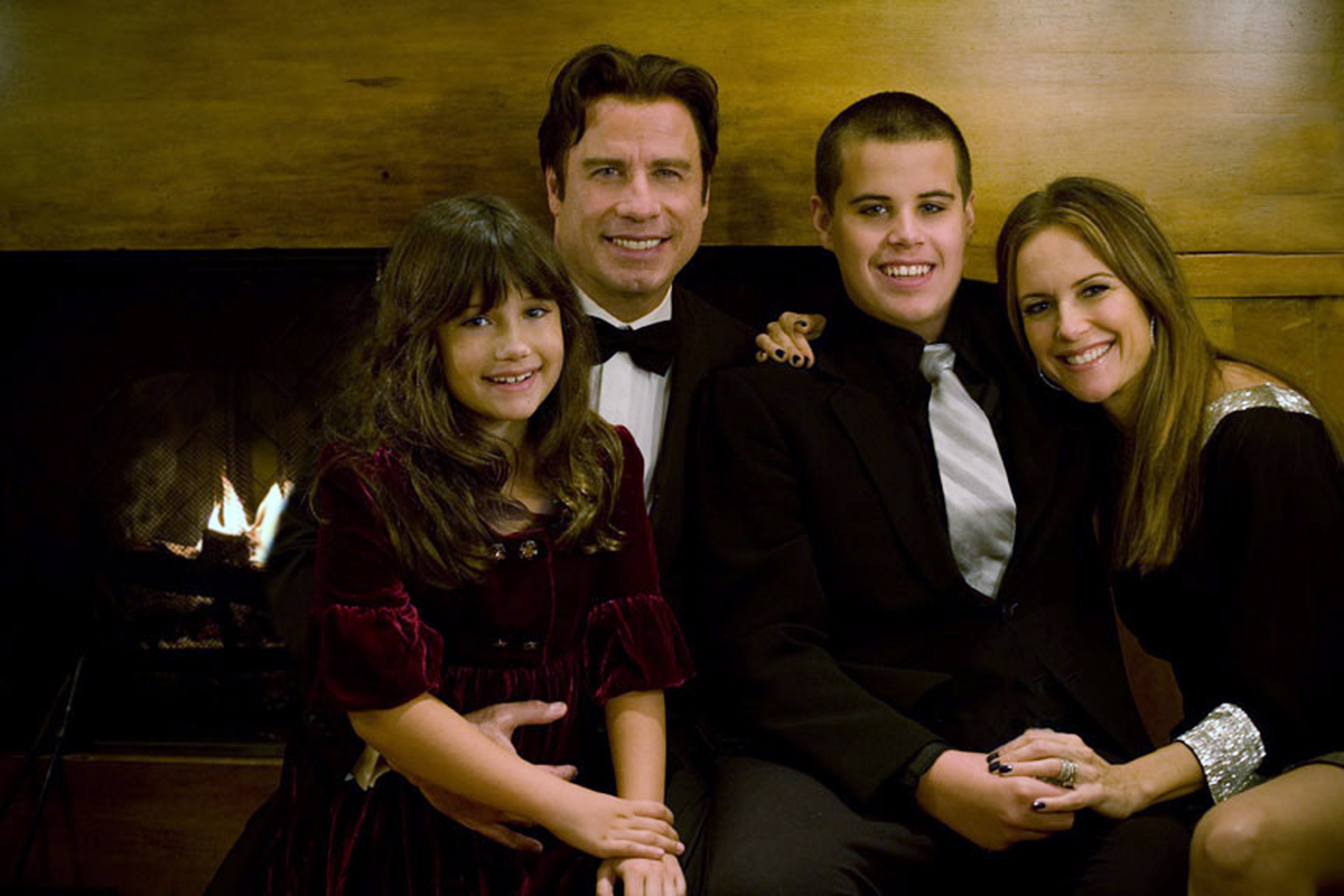 Ella, John Travolta, Kelly Preston, and Jett pose in an undated picture. | Source: Getty Images